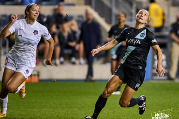 Washington Spirit's Ashley Hatch and Gotham FC's Gina Lewandowski run for the ball