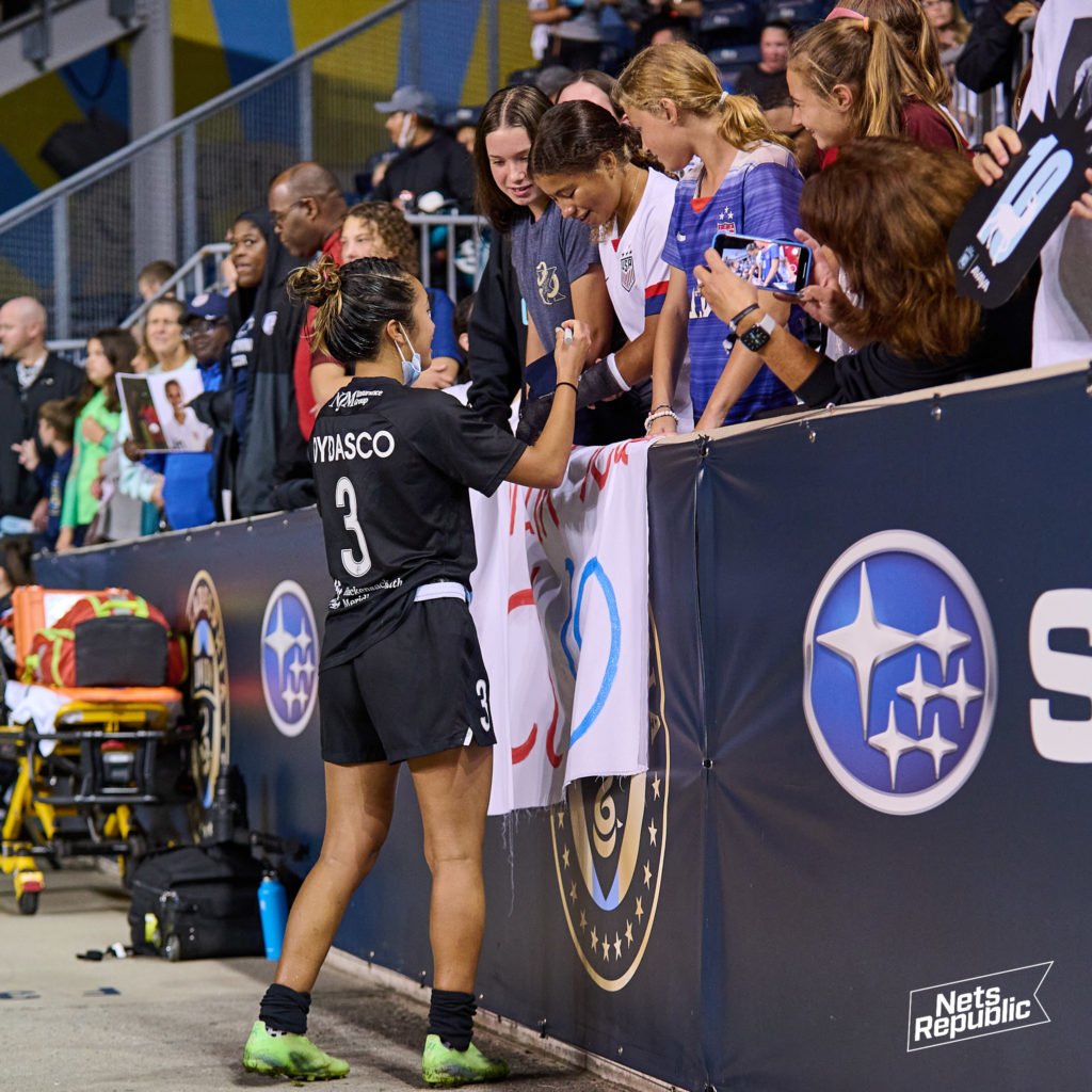Caprice Dydasco of Gotham FC signs autographs for young fans at Subaru Park on October 6, 2021 after a game against the Washington Spirit.