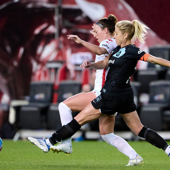 McCall Zerboni wins the ball off a Chicago Red Starts player