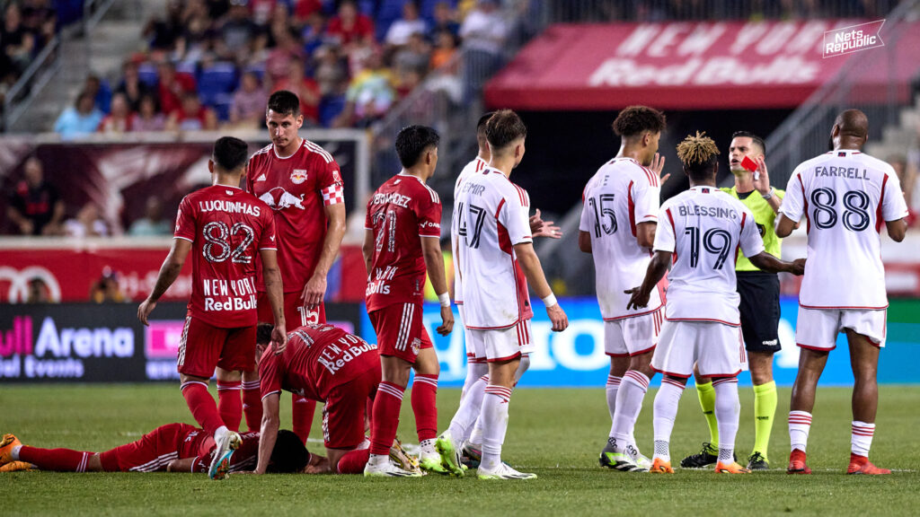 Red Bulls and Revolution players huddle around referee Rubiel Vasquez after a red card was issued to New England midfielder Latif Blessing. Important referee decisions were at the forefront of each of New York's last two home matches